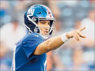  ?? ELSA | GETTY IMAGES ?? GIANTS QUARTERBAC­K Eli Manning, the two-time Super Bowl MVP, has looked strong and healthy in limited playing time in the preseason.