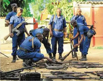  ?? Reuters ?? Gunning for peace Police collect weapons recovered from suspected fighters after clashes in the capital Bujumbura. More than 300 people have been killed in the past eight months.