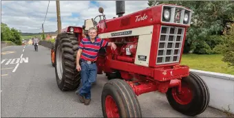  ??  ?? Aidan Ring with his huge American Internatio­nal 1466 Turbo 1972 tractor gets ready for the tractor run at the Liz Lucey Memorial Run.