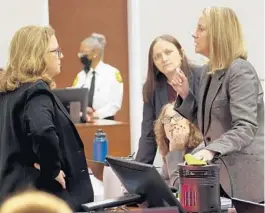  ?? AMY BETH BENNETT/SOUTH FLORIDA SUN SENTINEL ?? Assistant State Attorney Carolyn McCann, left, and Assistant Public Defender Melisa McNeill speak before the start of jury preselecti­on in the penalty phase of the trial of Marjory Stoneman Douglas High School shooter Nikolas Cruz at the Broward County Courthouse in Fort Lauderdale on Monday.