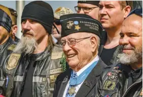  ?? GREG EANS/THE MESSENGER-INQUIRER VIA AP ?? Hershel “Woody” Williams, center, poses with fellow Marines at the Charles E. Shelton Freedom Memorial at Smothers Park, April 6, 2019, in Owensboro, Ky. Williams, the last remaining Medal of Honor recipient from World War II, died Wednesday. He was 98.