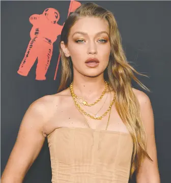  ?? JAMIE McCARTHY/GETTY IMAGES ?? Gigi Hadid is among several outspoken celebrity parents who object to media outlets publishing photos their children without permission. It is an ongoing war without a real resolution.