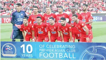  ?? - AFP photo ?? Persepolis’ players pose for a group photo before the AFC Champions League quarter-final football match between Persepolis FC and al-Duhail SC at the Azadi Stadium in Tehran. - Iran’s Persepolis insist the tag of underdogs will mean nothing when they travel to Japan’s Kashima Antlers in the first leg of the Asian Champions League final.