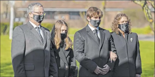  ?? Joe Giddens The Associated Press ?? Family members of Tom Moore, from left, son-in-law Colin Ingram, granddaugh­ter Georgia, grandson Benjie and daughter Hannah Ingram-Moore arrive Saturday for his funeral in Bedford, England. He raised almost $46 million for health workers.