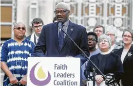  ?? Elizabeth Conley / Houston Chronicle ?? Mustafa Carroll, a member of the Faith Leaders Coalition of Greater Houston, said Monday that the current political climate resembles the pre-civil rights era.