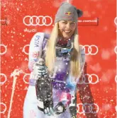  ?? Alessandro Trovati / Associated Press ?? American Lindsey Vonn sprays the bubbly after her second World Cup victory of the year.