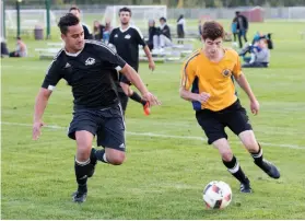  ?? CITIZEN FILE PHOTO ?? Onyx Stone (yellow) took on JTM Homes (black) on Sept. 16 during the North Cariboo Senior Soccer League open division final at NCSSL fields.