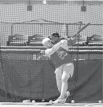  ?? CHRIS O’MEARA/AP ?? Yankees’ Luke Voit fouls off a pitch during an informal workout at the University of South Florida on Thursday in Tampa.