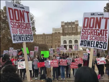  ?? Andrew DeMillo The Associated Press ?? Teachers, parents and students picket outside Central High School in Little Rock, Arkansas, on Thursday. An official said the city’s teachers could strike again.