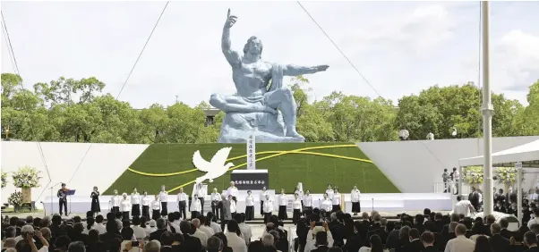  ?? ?? A choral group of A-bomb survivors performs to open a memorial ceremony on the 77th anniversar­y of the atomic bombing of Nagasaki in the city’s Peace Park on Tuesday.