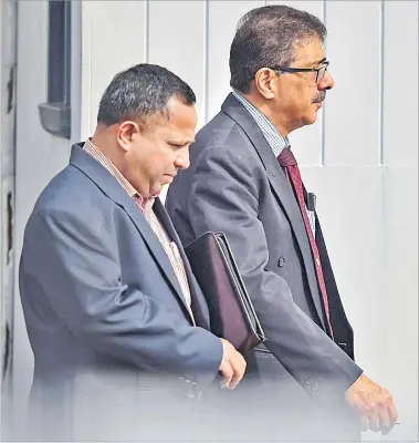  ?? Picture: FILE/RAMA ?? Former Fijian Holdings Ltd Group CEO Nouzab Fareed and his lawyer, Hemendra Nagin, are pictured outside the courthouse in Suva in July this year.