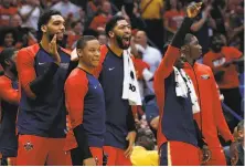  ?? Jonathan Bachman / Getty Images ?? New Orleans’ Anthony Davis (center) is questionab­le to play against the Warriors on Wednesday night at Oracle Arena.