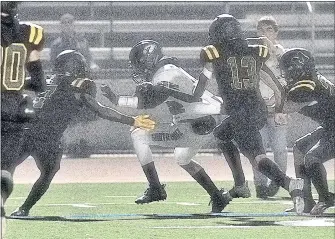  ?? LUCJAN SZEWCZYK — MONTEREY HERALD ?? Monterey High’s defense tries to stop Santa Cruz wide receiver Caleb Womack in the teams’ PCAL Mission Division opener at Monterey Peninsula College in September.