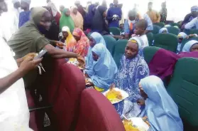  ?? Associated Press ?? Students from the Salihu Tanko Islamic School reunite with their parents last month in Minna, Nigeria, after they were kidnapped by gunmen for ransom.