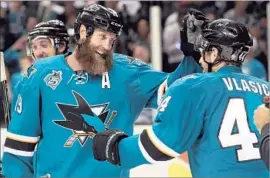  ?? Ezra Shaw Getty Images ?? SAN JOSE’S Joe Thornton, left, and Marc-Edouard Vlasic are among the Sharks who will make the first trip to the Stanley Cup Final in franchise history.