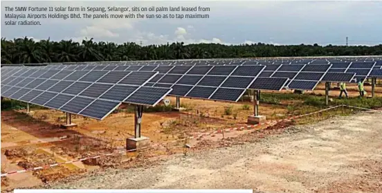  ??  ?? The 5MW Fortune 11 solar farm in Sepang, Selangor, sits on oil palm land leased from Malaysia airports Holdings bhd. The panels move with the sun so as to tap maximum solar radiation.