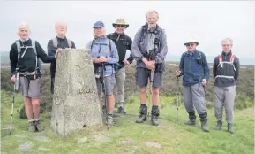  ??  ?? East Cheshire Ramblers pausing at the trig point on White Edge