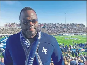  ?? [AP PHOTO/PAT GRAHAM] ?? Former Oklahoma State player Jermaine Birdow stands at Falcon Stadium as his son, Air Force running back Taven Birdow, and his teammates play Army on Nov. 2 at Air Force Academy, Colo.