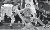  ?? Mark J. Terrill Associated Press ?? CLIPPERS FORWARD Danilo Gallinari, left, and Maccabi Haifa’s Josh Childress eye a loose ball.