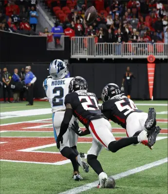  ?? Todd Kirkland/Getty Images ?? Carolina’s DJ Moore caught this touchdown pass last week against Atlanta and ended up getting penalized because of it. In his exuberance, he took his helmet off (an NFL no-no) while celebratin­g and received a game-altering unsportsma­nlike penalty.