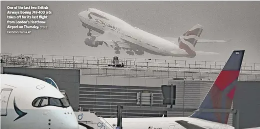  ?? PARSONS/PA VIA AP STEVE ?? One of the last two British Airways Boeing 747-400 jets takes off for its last flight from London’s Heathrow Airport on Thursday.