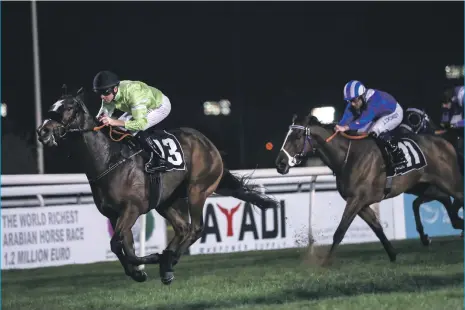  ?? Victor Besa / The National ?? Richard Mullen coaxed Galesburg, left, to the win in Race 5 in Abu Dhabi last night for trainer Satish Seemar