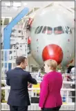  ??  ?? French President Emmanuel Macron and German Chancellor Angela Merkel visit the assembly line of Airbus A350 in Toulouse, southweste­rn France on Oct 16. French President Macron and German Chancellor Merkel are meeting in southern France, one day before a key EU summit that may approve a divorce
deal with Britain. (AP)