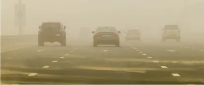  ??  ?? Al Khail Road on Friday. Motorists and road users were affected by the poor visibility across Dubai due to the sandstorm.