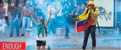  ?? Picture: AFP ?? Demonstrat­ors protest against President Nicolas Maduro’s government in Caracas on Saturday. The opposition is accusing pro-Maduro supreme court judges of attempting an internal ‘coup d’etat’.