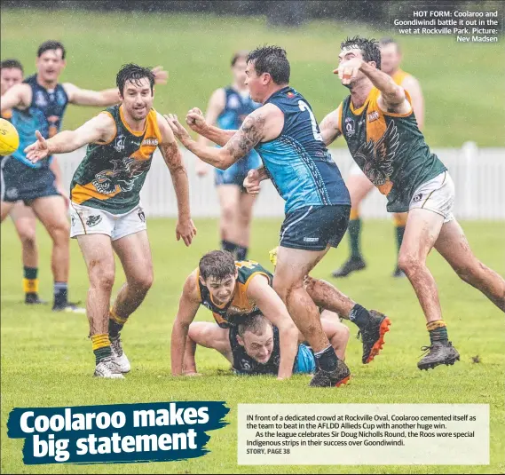  ?? Picture: Nev Madsen ?? HOT FORM: Coolaroo and Goondiwind­i battle it out in the wet at Rockville Park.