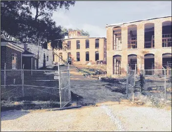  ??  ?? The Mary-Leila Cotton Mill closed in 2005 after more than a century. A $12 million redevelopm­ent plan has sparked a legal battle over environmen­tal concerns.