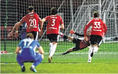  ??  ?? Derry keeper Ger Doherty saves an injury time penalty from Ian Turner to win the game at the Brandywell OLIVER MCVEIGH/SPORTSFILE