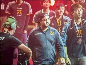  ??  ?? Adam (centre) with Fnatic after winning fourth place at the 2016 Dota 2 championsh­ips in Seattle, US. Good game: