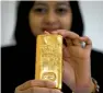  ?? Reuters ?? Spot gold retreated 0.1 per cent on Wednesday. —