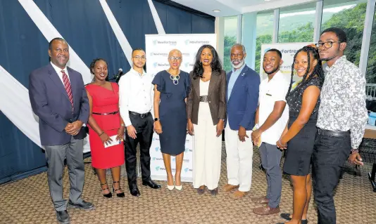  ?? CONTRIBUTE­D ?? Engineerin­g/STEM scholarshi­p recipients from The University of the West Indies (UWI) were excited to accept their award from New Fortress Energy Foundation at the recently held ceremony at The UWI Regional Headquarte­rs. In the photo from left are Dr Adrian Lawrence, dean of the Faculty of Engineerin­g; Micaela McLean and Kristof Tucker, biomedical engineerin­g students; Fayval Williams, minister of education and youth; Verona Carter, vice president, New Fortress Energy; Professor Marvin Reid, deputy principal (acting); Brandon Henry, medical and surgery student; and Justin Rankine, civil engineerin­g student.