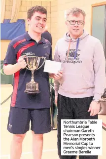  ??  ?? Northumbri­a Table Tennis League chairman Gareth Pearson presents the Alan Morpeth Memorial Cup to men’s singles winner Graeme Barella