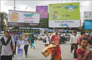  ?? KUNI TAKAHASHI / THE NEW YORK TIMES ?? A billboard in Bangalore, India, advertises Amazon.in, Amazon’s e-commerce site in India.