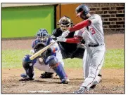  ?? AP/CHARLES REX ARBOGAST ?? Michael Taylor of the Washington Nationals connects on a grand slam Wednesday in the Nationals’ 5-0 victory over the Chicago Cubs in Game 4 of the National League division series. The Nationals host Game 5 tonight.