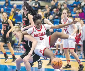  ??  ?? McGill Martlets’ Marie-Love Michel lands on Carlton Ravens’ Nicole Gilmore.