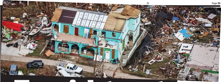  ??  ?? Havoc: A lone badly damaged house stands amid a sea of destructio­n on one of the islands