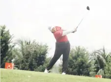  ?? — Bernama file photo ?? National golfer Ng Jing Xuen hits a shot during a tournament in Selangor.