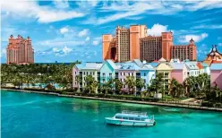  ?? ?? TUCK IN: The capital, Nassau. Top: Swimming pigs at Big Major Cay