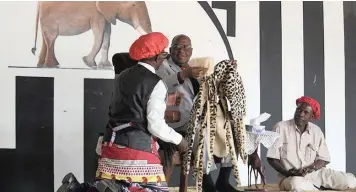  ?? | SARAH DAVIES ?? HERITAGE Furs are presented to the Lozi king.