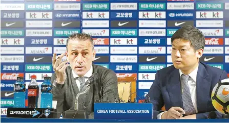  ?? Yonhap ?? Korean national football team head coach Paulo Bento, left, announces a roster for a pair of second-round Group H matches in the Asian qualificat­ion competitio­n for the 2022 FIFA World Cup at a press conference in Seoul, Monday.