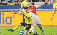  ?? FOTO: DPA ?? Die Dortmunder um Julian Weigl strauchelt­en in Monaco nicht.