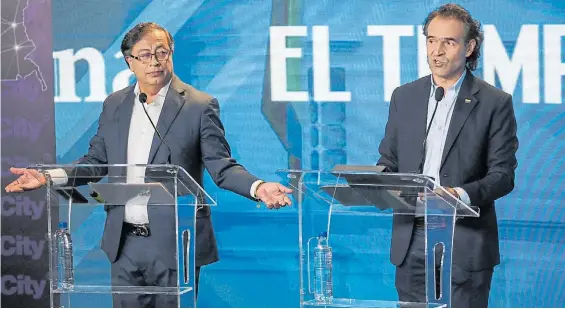  ?? ?? Candidatos. Gustavo Petro, de centroizqu­ierda, lidera la intención de voto, seguido por su rival de la coalición de derecha, Federico Gutiérrez.EFE