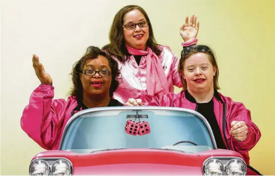  ?? Photos by Steve Gonzales / Staff photograph­er ?? “The Pink Ladies” — Kristina Roper, from left, Diana Delgado and Kerry Wylie — perform in the Down Syndrome Associatio­n of Houston Pantomime Troupe’s production of “Greased Lightning” from the film version of “Grease.” At top: Dillon Elrod dances in his role as one of the greasers.