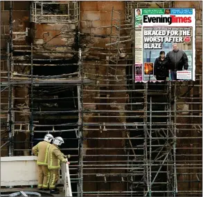  ??  ?? Work to salvage the remains of the Glasgow School of Art is continuing after the blaze. Inset, Saturday’s Evening Times