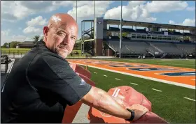  ?? NWA Democrat-Gazette/CHARLIE KAIJO ?? Keith Kilgore poses Friday for a portrait at the Heritage High School’s David Gates Stadium in Rogers. Kilgore is the new athletic director for the Rogers School District. “I want our coaches and athletes to understand we can lead the pack,” he said.