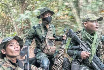  ?? NYT ?? Members of an ethnic militia in the back of a pickup patrol in a frontline area near government military positions in Kayin State of Myanmar in this file photo dated March 9, 2022.